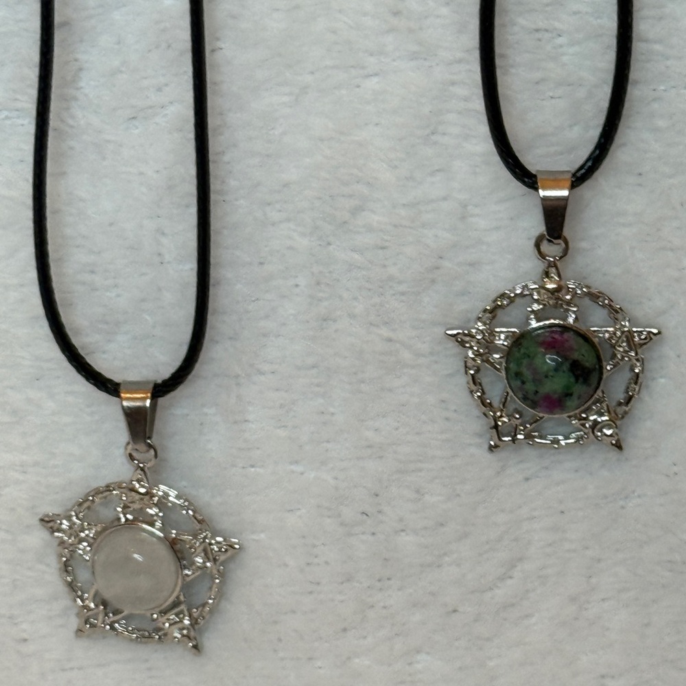 Silver Star Pendant Necklace Set of two. They come with a 20” cord necklace. NWT